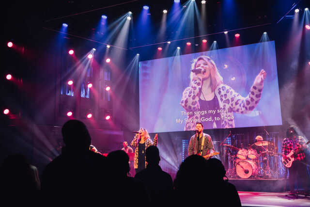 band leading worship on stage