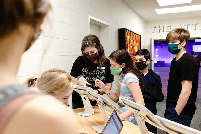 transit students checking in wearing masks